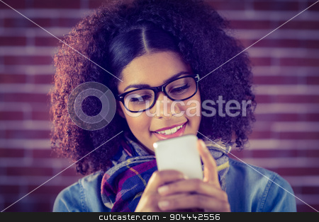 To use this stock image in your creative project, please select the size you need over to the right and click the "Add to Cart" button.
Your downloaded image will come with the Cutcaster watermark removed so don’t worry about the watermark you see on this page. Smiling attractive hipster texting stock photo, Smiling attractive hipster texting against red brick background by Wavebreak Media