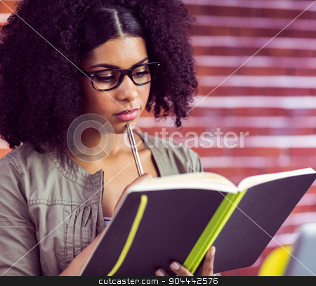 To use this stock image in your creative project, please select the size you need over to the right and click the "Add to Cart" button.
Your downloaded image will come with the Cutcaster watermark removed so don’t worry about the watermark you see on this page. Casual businesswoman looking in her diary stock photo, Casual businesswoman looking in her diary in her office by Wavebreak Media