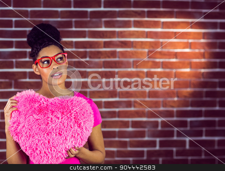 To use this stock image in your creative project, please select the size you need over to the right and click the "Add to Cart" button.
Your downloaded image will come with the Cutcaster watermark removed so don’t worry about the watermark you see on this page. Portrait black hair model holding a pink heart shaped pillow stock photo, Portrait black hair model holding a pink heart shaped pillow on a red brick wall by Wavebreak Media