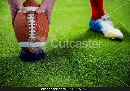 To use this stock image in your creative project, please select the size you need over to the right and click the "Add to Cart" button.
Your downloaded image will come with the Cutcaster watermark removed so don’t worry about the watermark you see on this page. American football player preparing for a drop kick stock photo, American football player preparing for a drop kick on american football field by Wavebreak Media