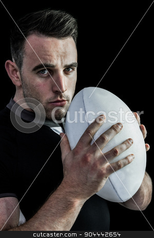 To use this stock image in your creative project, please select the size you need over to the right and click the "Add to Cart" button.
Your downloaded image will come with the Cutcaster watermark removed so don’t worry about the watermark you see on this page. Tough rugby player holding ball stock photo, Tough rugby player holding ball on black background by Wavebreak Media