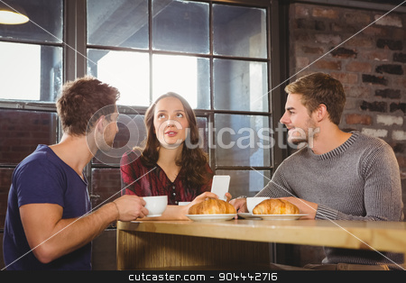 To use this stock image in your creative project, please select the size you need over to the right and click the "Add to Cart" button.
Your downloaded image will come with the Cutcaster watermark removed so don’t worry about the watermark you see on this page. Friends talking and enjoying coffee and croissants stock photo, Friends talking and enjoying coffee and croissants at coffee shop by Wavebreak Media