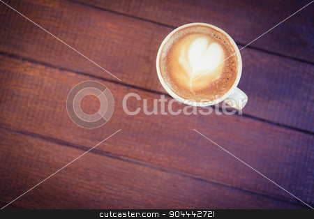 To use this stock image in your creative project, please select the size you need over to the right and click the "Add to Cart" button.
Your downloaded image will come with the Cutcaster watermark removed so don’t worry about the watermark you see on this page. Cup of cappuccino with coffee art on wooden table stock photo, Cup of cappuccino with coffee art on wooden table at coffee shop by Wavebreak Media