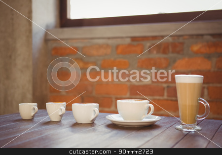 To use this stock image in your creative project, please select the size you need over to the right and click the "Add to Cart" button.
Your downloaded image will come with the Cutcaster watermark removed so don’t worry about the watermark you see on this page. Several hot beverages in a row on wooden table stock photo, Several hot beverages in a row on wooden table at coffee shop by Wavebreak Media