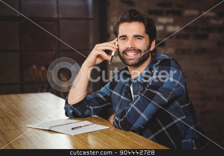 To use this stock image in your creative project, please select the size you need over to the right and click the "Add to Cart" button.
Your downloaded image will come with the Cutcaster watermark removed so don’t worry about the watermark you see on this page. Young man on the phone stock photo, Young man on the phone in a cafe by Wavebreak Media