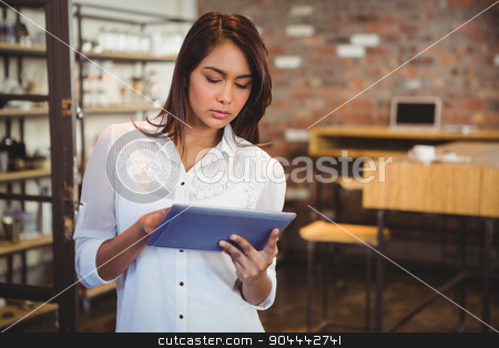 To use this stock image in your creative project, please select the size you need over to the right and click the "Add to Cart" button.
Your downloaded image will come with the Cutcaster watermark removed so don’t worry about the watermark you see on this page. Smiling young businesswoman holding a tablet stock photo, Smiling young businesswoman holding a tablet in her office by Wavebreak Media