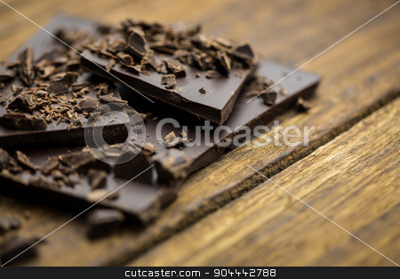 To use this stock image in your creative project, please select the size you need over to the right and click the "Add to Cart" button.
Your downloaded image will come with the Cutcaster watermark removed so don’t worry about the watermark you see on this page. Pieces of chocolate on a wooden table stock photo, Close up view of pieces of chocolate on a wooden table by Wavebreak Media