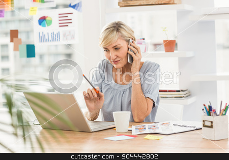 To use this stock image in your creative project, please select the size you need over to the right and click the "Add to Cart" button.
Your downloaded image will come with the Cutcaster watermark removed so don’t worry about the watermark you see on this page. Businesswoman using laptop while on the phone stock photo, Serious businesswoman using laptop while on the phone at office by Wavebreak Media