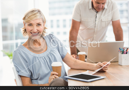 To use this stock image in your creative project, please select the size you need over to the right and click the "Add to Cart" button.
Your downloaded image will come with the Cutcaster watermark removed so don’t worry about the watermark you see on this page. Smiling businesswoman looking at the camera stock photo, Portrait of a businesswoman working on tablet at the office by Wavebreak Media