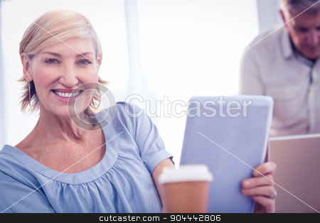 To use this stock image in your creative project, please select the size you need over to the right and click the "Add to Cart" button.
Your downloaded image will come with the Cutcaster watermark removed so don’t worry about the watermark you see on this page. Smiling businesswoman looking at the camera stock photo, Portrait of a businesswoman working on tablet at the office by Wavebreak Media