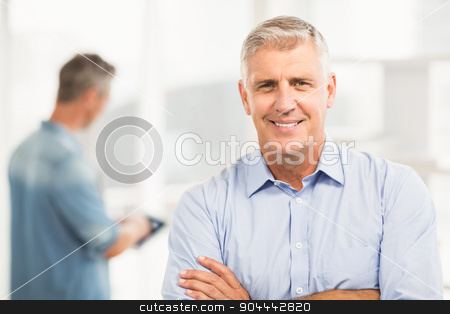 To use this stock image in your creative project, please select the size you need over to the right and click the "Add to Cart" button.
Your downloaded image will come with the Cutcaster watermark removed so don’t worry about the watermark you see on this page. Smiling businessman with arms folded stock photo, Portrait of a smiling businessman with arms folded at the office by Wavebreak Media
