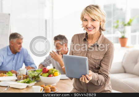 To use this stock image in your creative project, please select the size you need over to the right and click the "Add to Cart" button.
Your downloaded image will come with the Cutcaster watermark removed so don’t worry about the watermark you see on this page. Smiling casual businesswoman using tablet at lunch stock photo, Portrait of smiling casual businesswoman using tablet at lunch in the office by Wavebreak Media