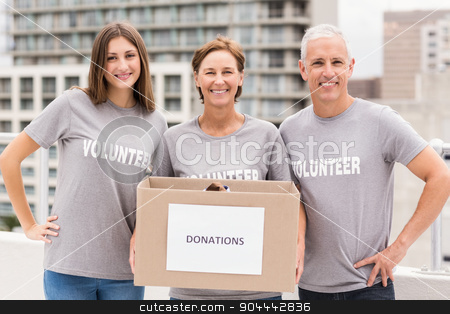 To use this stock image in your creative project, please select the size you need over to the right and click the "Add to Cart" button.
Your downloaded image will come with the Cutcaster watermark removed so don’t worry about the watermark you see on this page. Smiling volunteers holding donation box stock photo, Portrait of smiling volunteers holding donation box on roof of building by Wavebreak Media