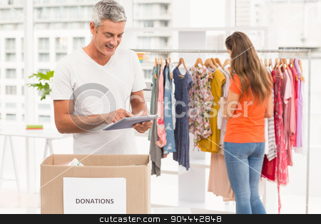 To use this stock image in your creative project, please select the size you need over to the right and click the "Add to Cart" button.
Your downloaded image will come with the Cutcaster watermark removed so don’t worry about the watermark you see on this page. Casual businessman with donation box and tablet stock photo, Casual businessman with donation box and tablet in the office by Wavebreak Media