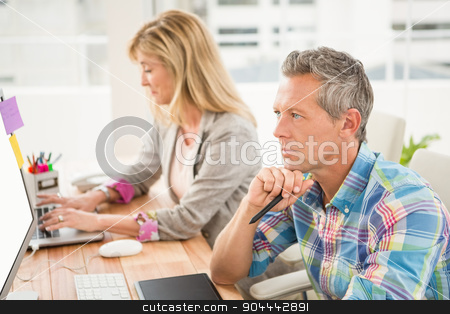 To use this stock image in your creative project, please select the size you need over to the right and click the "Add to Cart" button.
Your downloaded image will come with the Cutcaster watermark removed so don’t worry about the watermark you see on this page. Creative design team working at desk stock photo, Creative design team working at desk in the office by Wavebreak Media