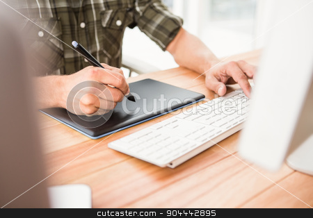 To use this stock image in your creative project, please select the size you need over to the right and click the "Add to Cart" button.
Your downloaded image will come with the Cutcaster watermark removed so don’t worry about the watermark you see on this page. Casual designer using computer and digitizer stock photo, Casual designer using computer and digitizer in the office by Wavebreak Media