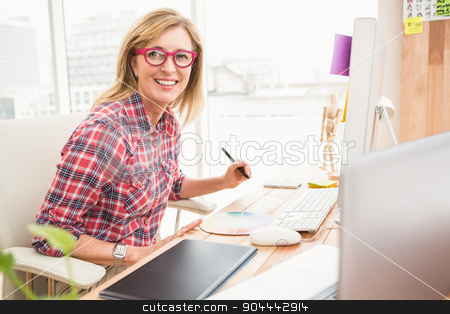To use this stock image in your creative project, please select the size you need over to the right and click the "Add to Cart" button.
Your downloaded image will come with the Cutcaster watermark removed so don’t worry about the watermark you see on this page. Casual designer working and smiling at camera stock photo, Portrait of casual designer working and smiling at camera in the office by Wavebreak Media