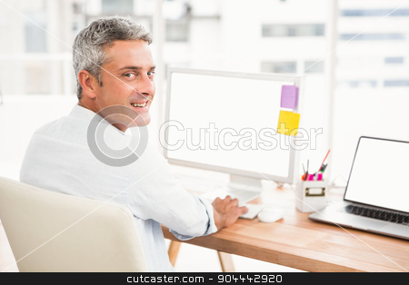To use this stock image in your creative project, please select the size you need over to the right and click the "Add to Cart" button.
Your downloaded image will come with the Cutcaster watermark removed so don’t worry about the watermark you see on this page. Smiling casual businessman working with computer stock photo, Portrait of smiling casual businessman working with computer in the office by Wavebreak Media
