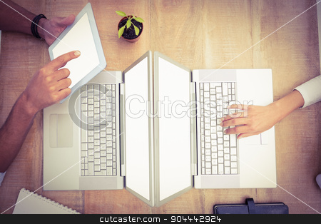 To use this stock image in your creative project, please select the size you need over to the right and click the "Add to Cart" button.
Your downloaded image will come with the Cutcaster watermark removed so don’t worry about the watermark you see on this page. Casual business colleagues using several devices stock photo, Casual business colleagues using several devices on wooden desk by Wavebreak Media
