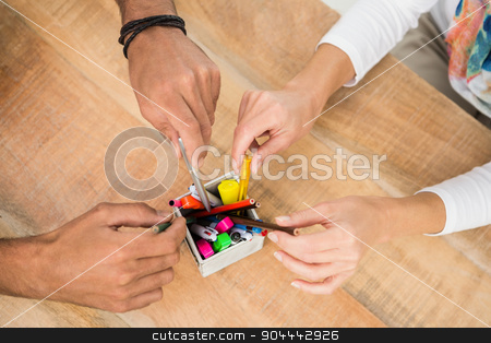 To use this stock image in your creative project, please select the size you need over to the right and click the "Add to Cart" button.
Your downloaded image will come with the Cutcaster watermark removed so don’t worry about the watermark you see on this page. Casual business colleagues sorting pens stock photo, Casual business colleagues sorting pens on wooden desk by Wavebreak Media