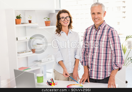 To use this stock image in your creative project, please select the size you need over to the right and click the "Add to Cart" button.
Your downloaded image will come with the Cutcaster watermark removed so don’t worry about the watermark you see on this page. Smiling casual designers working with colour chart stock photo, Portrait of smiling casual designers working with colour chart in the office by Wavebreak Media