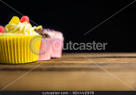 To use this stock image in your creative project, please select the size you need over to the right and click the "Add to Cart" button.
Your downloaded image will come with the Cutcaster watermark removed so don’t worry about the watermark you see on this page. Delicious cupcakes on a table stock photo, Delicious cupcakes on a table shot in studio by Wavebreak Media
