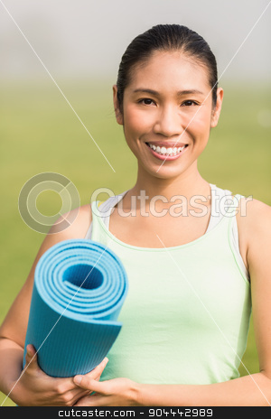 To use this stock image in your creative project, please select the size you need over to the right and click the "Add to Cart" button.
Your downloaded image will come with the Cutcaster watermark removed so don’t worry about the watermark you see on this page. Smiling sporty woman holding exercise mat stock photo, Portrait of smiling sporty woman holding exercise mat in parkland by Wavebreak Media