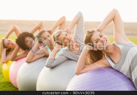 To use this stock image in your creative project, please select the size you need over to the right and click the "Add to Cart" button.
Your downloaded image will come with the Cutcaster watermark removed so don’t worry about the watermark you see on this page. Smiling sporty women working out with exercise balls stock photo, Portrait of smiling sporty women working out with exercise balls in parkland by Wavebreak Media