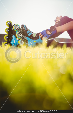 To use this stock image in your creative project, please select the size you need over to the right and click the "Add to Cart" button.
Your downloaded image will come with the Cutcaster watermark removed so don’t worry about the watermark you see on this page. Woman wearing inline skates sitting in grass stock photo, Woman wearing inline skates sitting in grass at promenade by Wavebreak Media