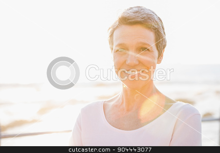 To use this stock image in your creative project, please select the size you need over to the right and click the "Add to Cart" button.
Your downloaded image will come with the Cutcaster watermark removed so don’t worry about the watermark you see on this page. Smiling sporty woman at promenade stock photo, Portrait of smiling sporty woman at promenade on a sunny day by Wavebreak Media