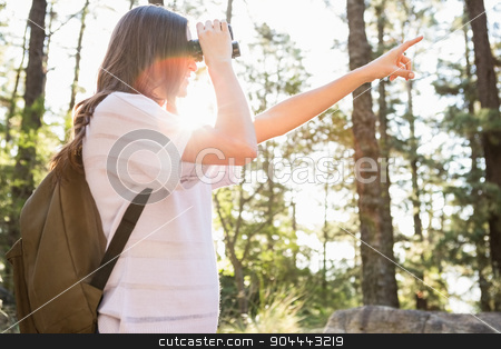 To use this stock image in your creative project, please select the size you need over to the right and click the "Add to Cart" button.
Your downloaded image will come with the Cutcaster watermark removed so don’t worry about the watermark you see on this page. Smiling brunette hiker looking through binoculars stock photo, Smiling brunette hiker looking through binoculars in the nature by Wavebreak Media