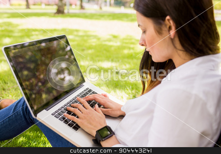 To use this stock image in your creative project, please select the size you need over to the right and click the "Add to Cart" button.
Your downloaded image will come with the Cutcaster watermark removed so don’t worry about the watermark you see on this page. Beautiful brunette using laptop in the park stock photo, Beautiful brunette using laptop in the park on a sunny day by Wavebreak Media