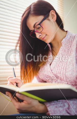 To use this stock image in your creative project, please select the size you need over to the right and click the "Add to Cart" button.
Your downloaded image will come with the Cutcaster watermark removed so don’t worry about the watermark you see on this page. Pretty brunette studying beside window stock photo, Pretty brunette studying beside window in a bright room by Wavebreak Media