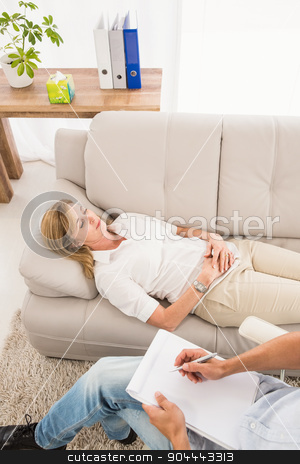 To use this stock image in your creative project, please select the size you need over to the right and click the "Add to Cart" button.
Your downloaded image will come with the Cutcaster watermark removed so don’t worry about the watermark you see on this page. Unhappy woman lying on couch and talking to therapist stock photo, Unhappy woman lying on couch and talking to therapist in the office by Wavebreak Media