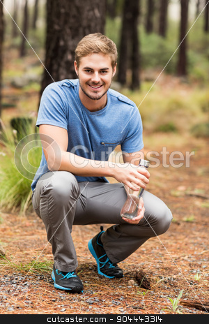 To use this stock image in your creative project, please select the size you need over to the right and click the "Add to Cart" button.
Your downloaded image will come with the Cutcaster watermark removed so don’t worry about the watermark you see on this page. Portrait of a handsome man holding a water bottle stock photo, Portrait of a handsome man holding a water bottle in the nature by Wavebreak Media