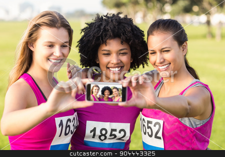 To use this stock image in your creative project, please select the size you need over to the right and click the "Add to Cart" button.
Your downloaded image will come with the Cutcaster watermark removed so don’t worry about the watermark you see on this page. Runners supporting breast cancer marathon and taking selfies stock photo, Runners supporting breast cancer marathon and taking selfies in parkland by Wavebreak Media