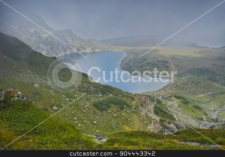 To use this stock image in your creative project, please select the size you need over to the right and click the "Add to Cart" button.
Your downloaded image will come with the Cutcaster watermark removed so don’t worry about the watermark you see on this page. The Kidney lake and approaching clouds stock photo, The Kidney lake and approaching clouds, The Seven Rila Lakes, Bulgaria by Stoyan Haytov