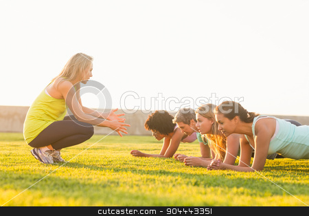 To use this stock image in your creative project, please select the size you need over to the right and click the "Add to Cart" button.
Your downloaded image will come with the Cutcaster watermark removed so don’t worry about the watermark you see on this page. Sporty women planking during fitness class stock photo, Sporty women planking during fitness class in parkland by Wavebreak Media