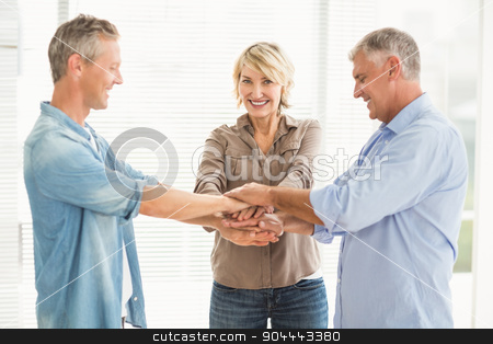 To use this stock image in your creative project, please select the size you need over to the right and click the "Add to Cart" button.
Your downloaded image will come with the Cutcaster watermark removed so don’t worry about the watermark you see on this page. Smiling business colleagues stacking hands stock photo, Portrait of smiling business colleagues stacking hands at the office by Wavebreak Media