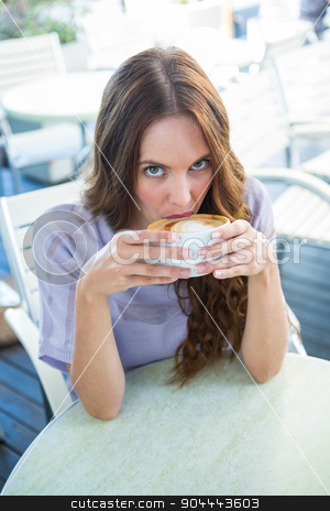 To use this stock image in your creative project, please select the size you need over to the right and click the "Add to Cart" button.
Your downloaded image will come with the Cutcaster watermark removed so don’t worry about the watermark you see on this page. Pretty brunette enjoying a cappuccino stock photo, Pretty brunette enjoying a cappuccino on a sunny day by Wavebreak Media