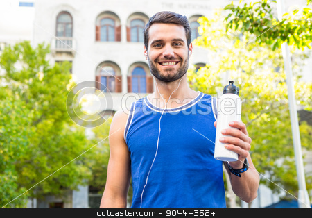 To use this stock image in your creative project, please select the size you need over to the right and click the "Add to Cart" button.
Your downloaded image will come with the Cutcaster watermark removed so don’t worry about the watermark you see on this page. Handsome athlete smiling and holding bottle stock photo, Portrait of handsome athlete smiling and holding bottle in the city by Wavebreak Media