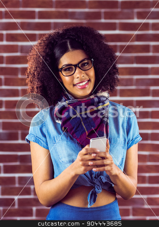 To use this stock image in your creative project, please select the size you need over to the right and click the "Add to Cart" button.
Your downloaded image will come with the Cutcaster watermark removed so don’t worry about the watermark you see on this page. Smiling attractive hipster texting stock photo, Portrait of smiling attractive hipster texting against red brick background by Wavebreak Media