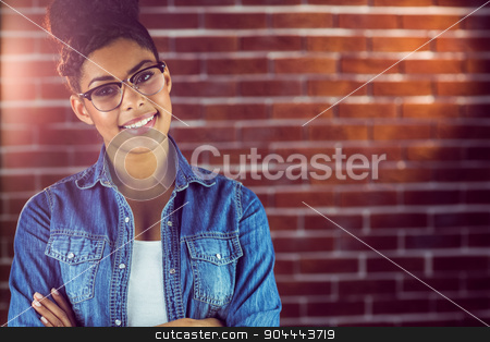 To use this stock image in your creative project, please select the size you need over to the right and click the "Add to Cart" button.
Your downloaded image will come with the Cutcaster watermark removed so don’t worry about the watermark you see on this page. Gorgeous hipster posing with glasses stock photo, Portrait of a gorgeous hipster posing with glasses against red brick background by Wavebreak Media