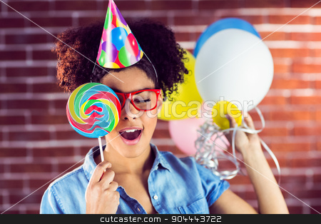 To use this stock image in your creative project, please select the size you need over to the right and click the "Add to Cart" button.
Your downloaded image will come with the Cutcaster watermark removed so don’t worry about the watermark you see on this page. Young woman holding balloons and lollipop stock photo, Young woman holding balloons and lollipop against a red brick wall by Wavebreak Media
