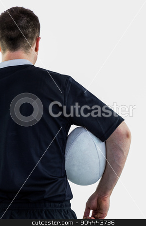 To use this stock image in your creative project, please select the size you need over to the right and click the "Add to Cart" button.
Your downloaded image will come with the Cutcaster watermark removed so don’t worry about the watermark you see on this page. Rugby player holding a rugby ball stock photo, Back view of a rugby player holding a rugby ball by Wavebreak Media