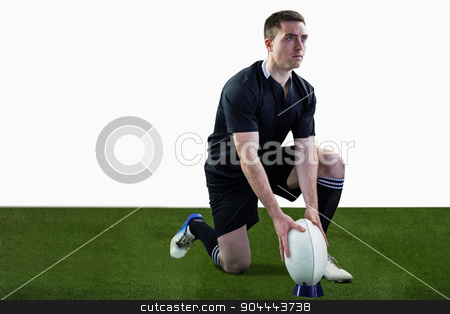 To use this stock image in your creative project, please select the size you need over to the right and click the "Add to Cart" button.
Your downloaded image will come with the Cutcaster watermark removed so don’t worry about the watermark you see on this page. Rugby player ready to make a drop kick stock photo, Attentive rugby player ready to make a drop kick by Wavebreak Media