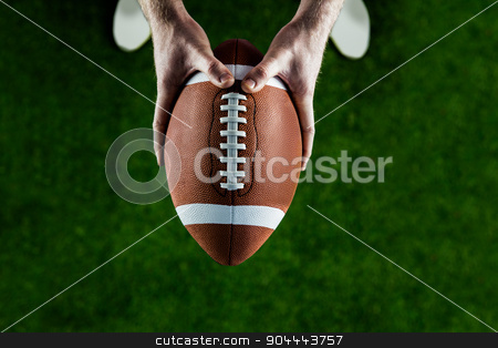 To use this stock image in your creative project, please select the size you need over to the right and click the "Add to Cart" button.
Your downloaded image will come with the Cutcaster watermark removed so don’t worry about the watermark you see on this page. American football player holding up football stock photo, American football player holding up football on american football field by Wavebreak Media