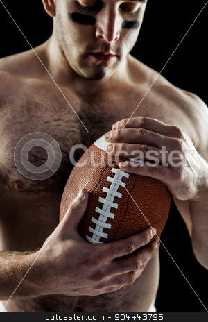 To use this stock image in your creative project, please select the size you need over to the right and click the "Add to Cart" button.
Your downloaded image will come with the Cutcaster watermark removed so don’t worry about the watermark you see on this page. Shirtless American football player with ball stock photo, Shirtless American football player with ball on black background by Wavebreak Media
