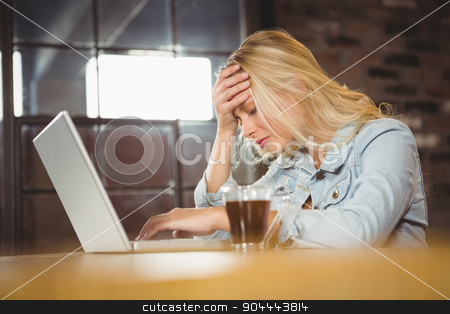 To use this stock image in your creative project, please select the size you need over to the right and click the "Add to Cart" button.
Your downloaded image will come with the Cutcaster watermark removed so don’t worry about the watermark you see on this page. Overworked blonde sitting and using laptop stock photo, Overworked blonde sitting and using laptop at coffee shop by Wavebreak Media