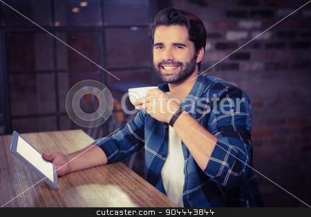 To use this stock image in your creative project, please select the size you need over to the right and click the "Add to Cart" button.
Your downloaded image will come with the Cutcaster watermark removed so don’t worry about the watermark you see on this page. Young man using his tablet stock photo, Young man using his tablet in cafe by Wavebreak Media